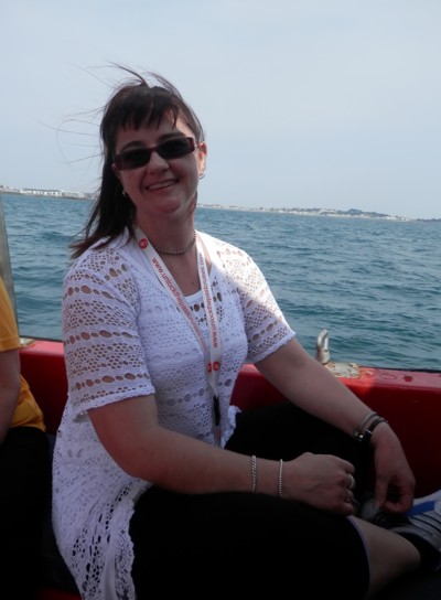 here's me coming back on the tender boat from Guernsey [thanks to Wardika, the ship photographer for this one]