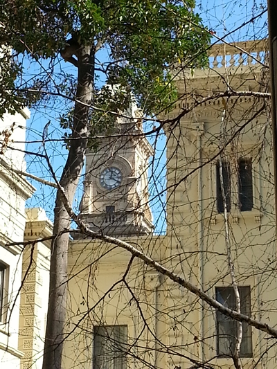 seeing the town hall clock tower from the courtyard of the Old Treasury Building