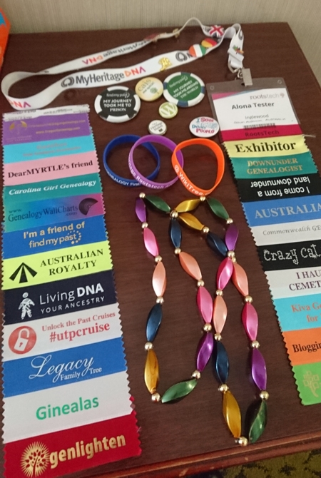 my collection of bling: ribbons, badges, beads and wristbands